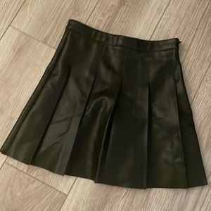Black leather pleated mini skirt